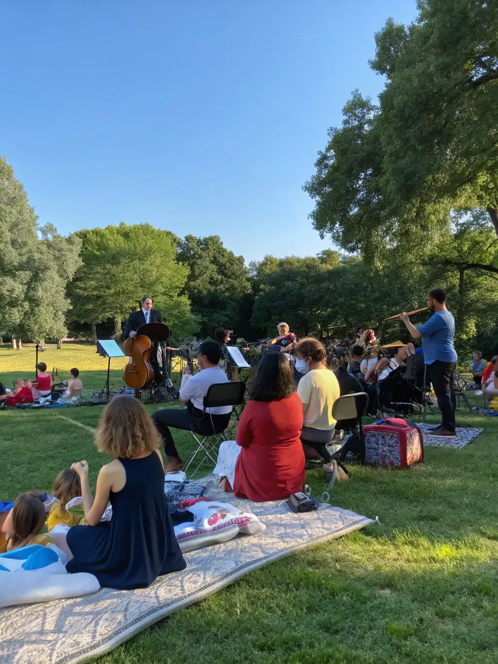 An engaging image of a community concert in a small European village, with local residents and visiting musicians sharing the stage.